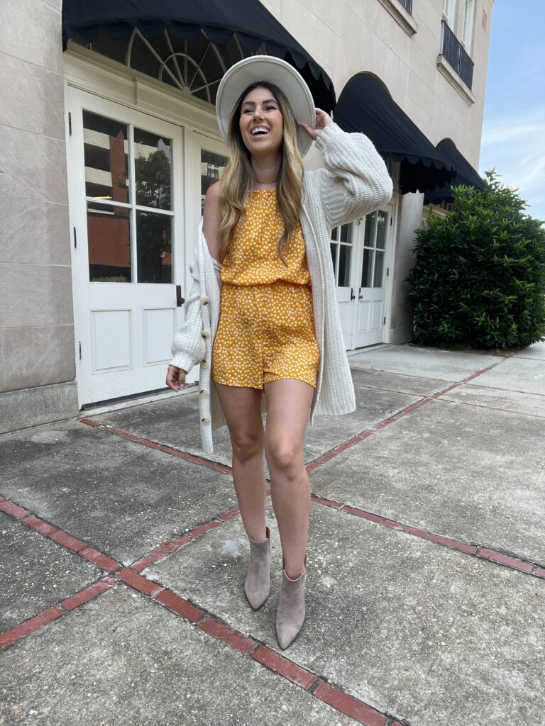 romper with boots, cardigan, and fedora hat 