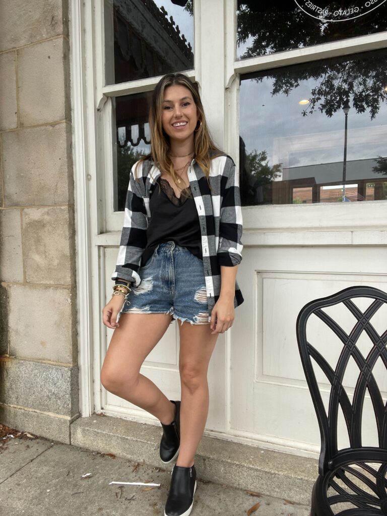 outdoor outfit photo with a flannel and sneaker wedges 