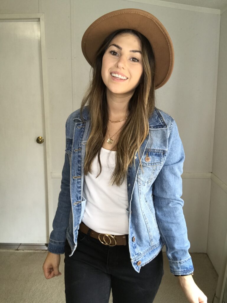 An outfit picture with brown accessories and a jean jacket 