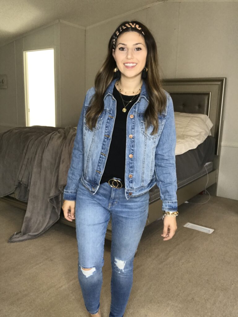 styling a jean jacket with a black tee shirt and jeans 