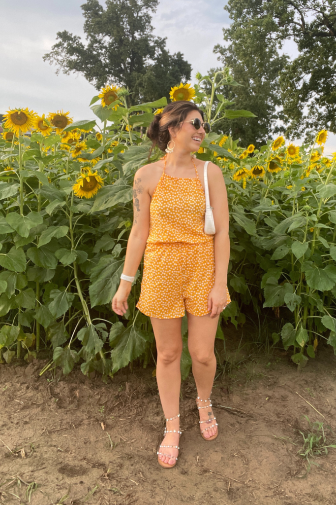 sunflower photoshoot outfit of me in a yellow romper and sunglasses 